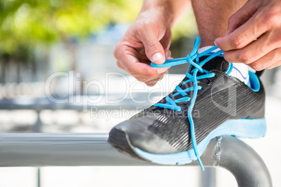 Athlete tying his shoes