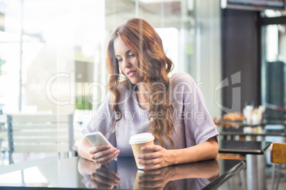 Pretty brunette enjoying a coffee