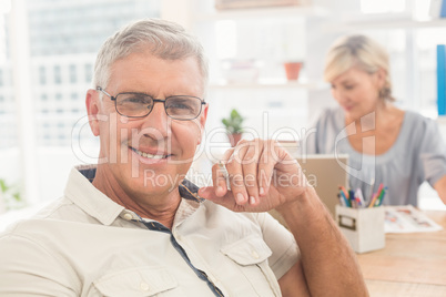 Smiling businessman looking at the camera