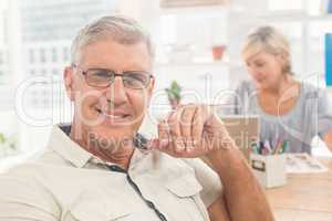 Smiling businessman looking at the camera