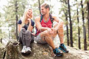 Young happy hiker couple looking at each other