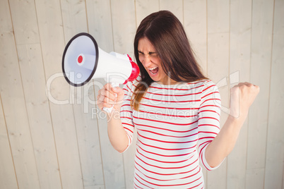 Pretty hipster shouting through megaphone