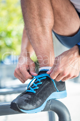 Athlete tying his shoes