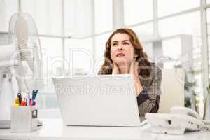 Casual businesswoman sitting at desk