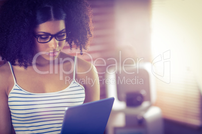 Happy beautiful hipster holding her tablet