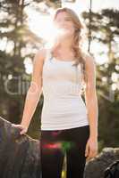 Young happy jogger looking at something in the distance