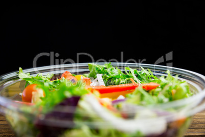 Healthy bowl of salad on table