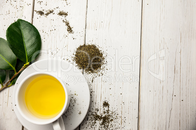 Cup of herbal tea on table