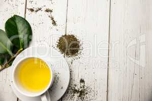 Cup of herbal tea on table