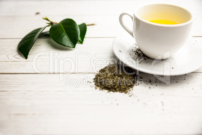 Cup of herbal tea on table