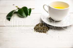 Cup of herbal tea on table