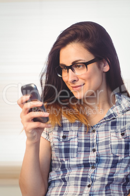 Pretty hipster using her phone