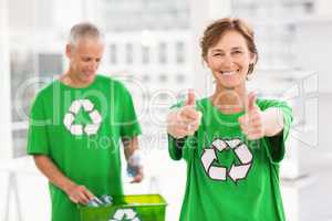 Smiling eco-minded woman doing thumbs up
