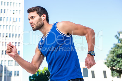 Handsome athlete jogging