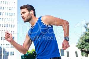 Handsome athlete jogging