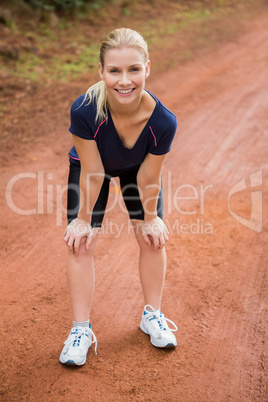 Smiling athletic blonde resting