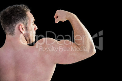 Strong bodybuilder with arms up