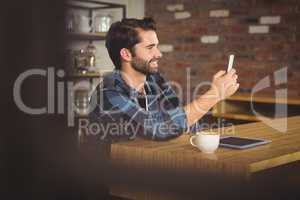 Young student using his smartphone