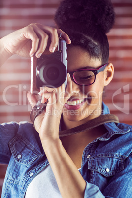 Young hipster taking a picture