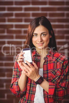 Hipster showing her smartphone