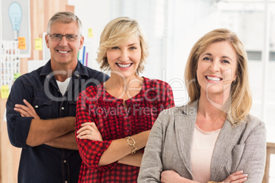 Smiling business team looking at the camera