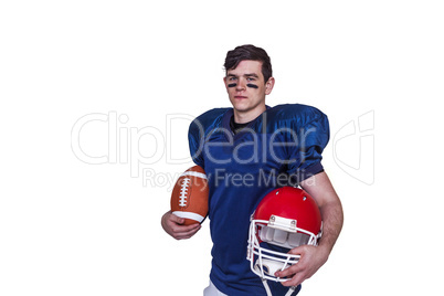 American football player holding a ball and helmet