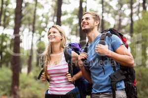 Young happy hiker couple looking in the distance