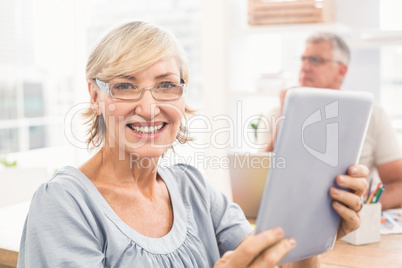 Smiling businesswoman holding a tablet Smiling businesswoman holding a tablet