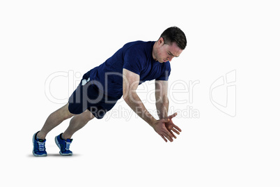 A fit man doing clapping hands push ups