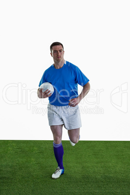 Rugby player running with the rugby ball Rugby player running with the rugby ball