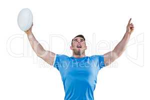 Rugby player cheering and pointing