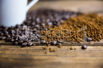 Coffee beans on a table with cup