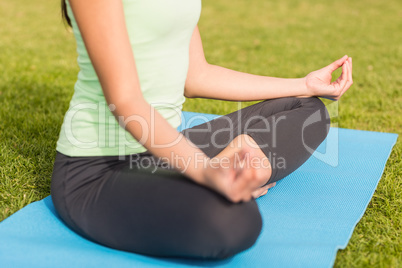 Sporty woman meditating