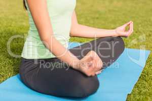 Sporty woman meditating