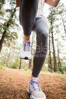 Young happy jogger walking