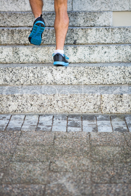 Athlete jogging up the stairs