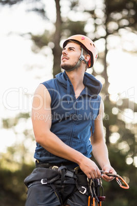 Handsome young hiker looking away