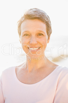 Smiling sporty woman at promenade