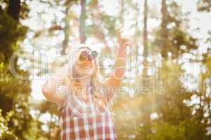 Pretty young blonde looking through binoculars