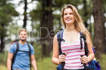 Pretty young hiker with friend