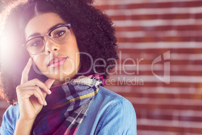 Portrait of attractive hipster thinking