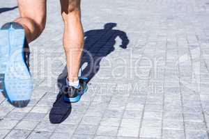 Close up view of athletes legs running