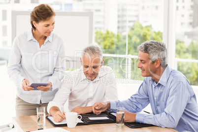 Smiling business people making an arrangement
