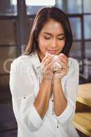 Beautiful woman drinking a coffee and looking away