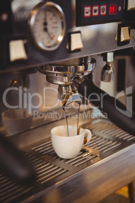 Machine making a cup of coffee