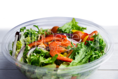 Healthy bowl of salad on table