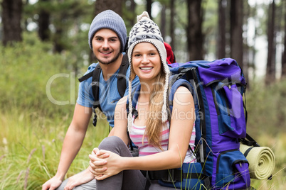 Portrait of a young smiling hiker couple