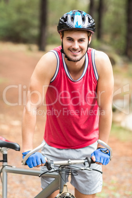 Handsome young biker looking at camera