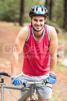 Handsome young biker looking at camera