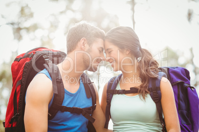 Young happy joggers touching foreheads